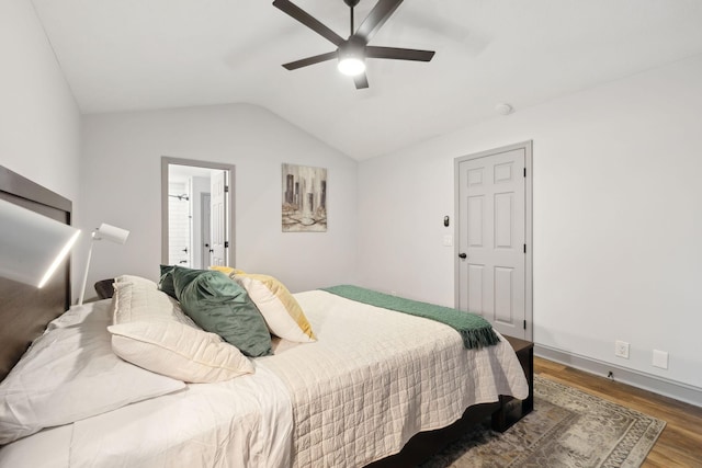 bedroom with ceiling fan, hardwood / wood-style floors, and lofted ceiling