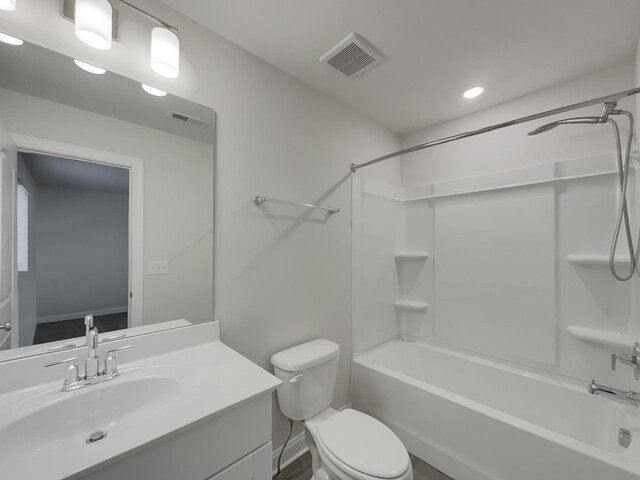 full bathroom with toilet, vanity, and washtub / shower combination