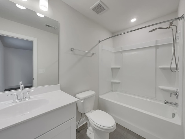 full bathroom featuring vanity, shower / bath combination, toilet, and hardwood / wood-style flooring