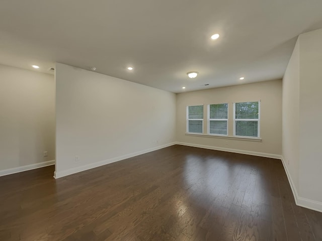 empty room featuring dark wood-type flooring