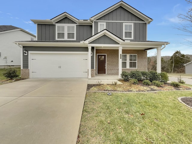 view of front of property with a front lawn and a garage