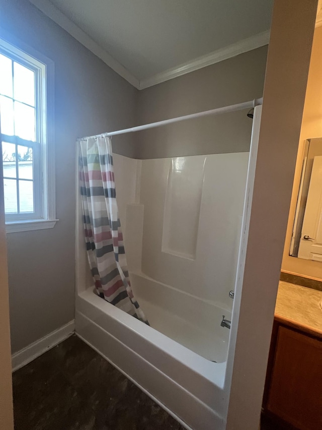 bathroom with vanity, shower / bath combo with shower curtain, and crown molding