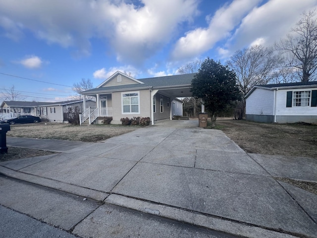 single story home featuring a carport