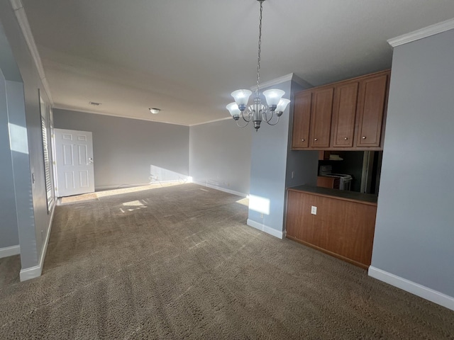 kitchen with carpet flooring, ornamental molding, hanging light fixtures, and a chandelier