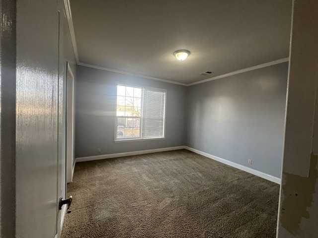 carpeted empty room with crown molding