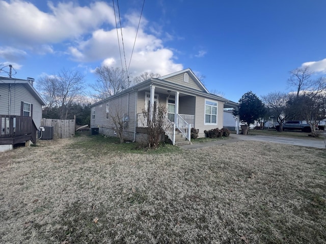 view of front of property with cooling unit and a porch