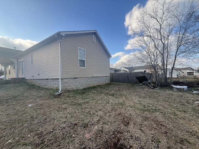 view of property exterior featuring a lawn