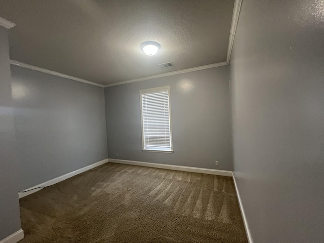 empty room with a textured ceiling, carpet floors, and crown molding