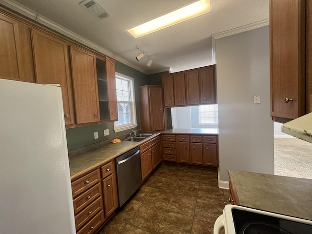 kitchen featuring stove, track lighting, ornamental molding, white refrigerator, and dishwasher