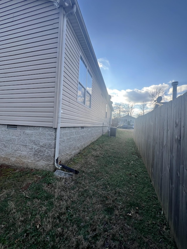 view of property exterior with a lawn