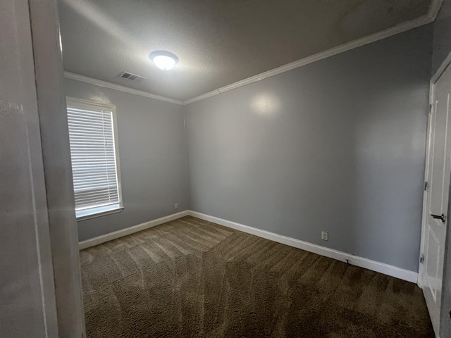 spare room with carpet flooring, a textured ceiling, and crown molding