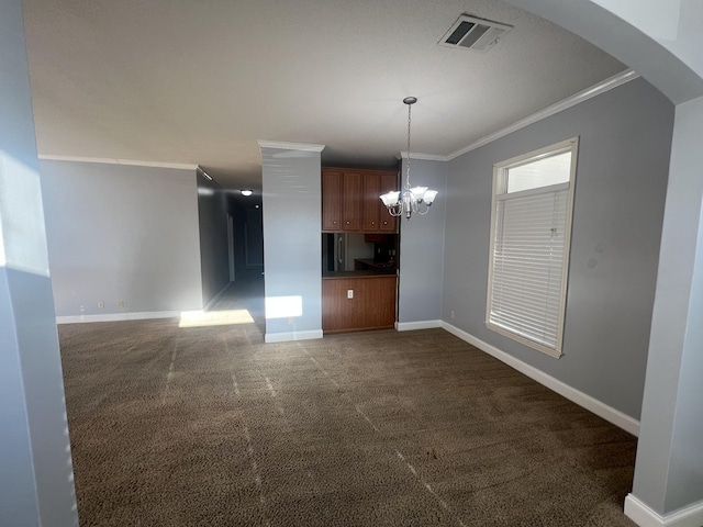 kitchen featuring dark colored carpet, a chandelier, decorative light fixtures, and ornamental molding