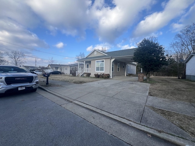 single story home featuring a carport