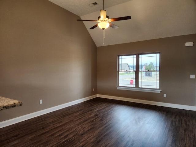 empty room featuring ceiling fan, dark hardwood / wood-style flooring, and high vaulted ceiling