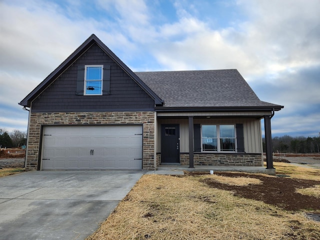 craftsman house featuring covered porch and a garage