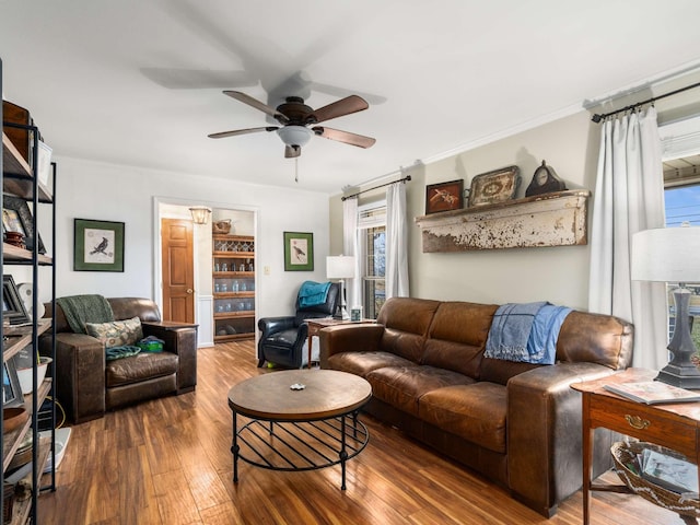 living room with hardwood / wood-style flooring and ceiling fan