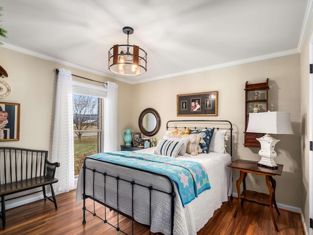 bedroom featuring dark hardwood / wood-style flooring, an inviting chandelier, and ornamental molding