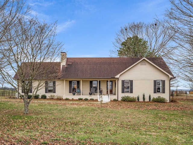 single story home with a porch and a front lawn