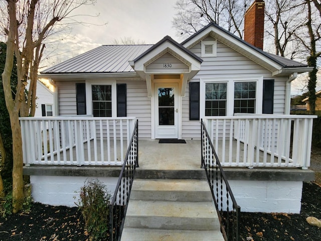 bungalow-style home with a porch