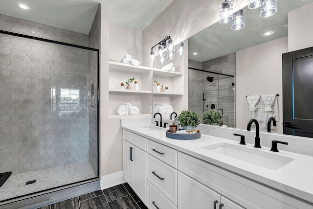 bathroom featuring vanity and an enclosed shower