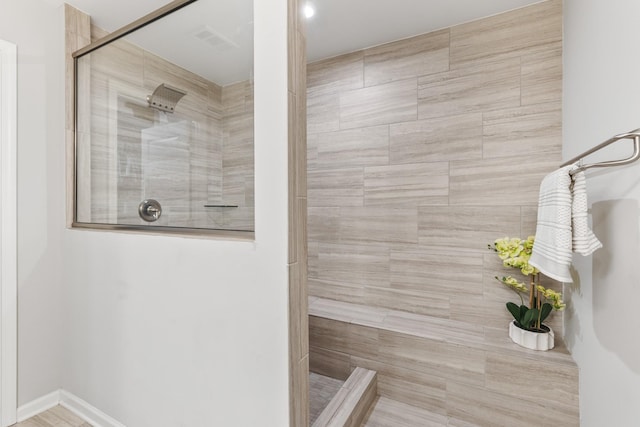 bathroom with tiled shower