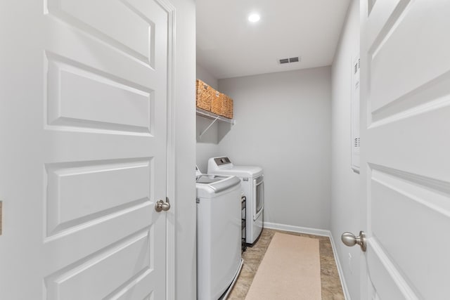 laundry room with washing machine and clothes dryer