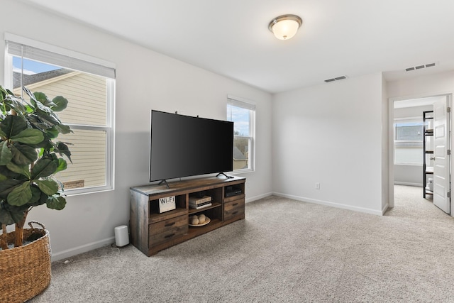 living room featuring light colored carpet