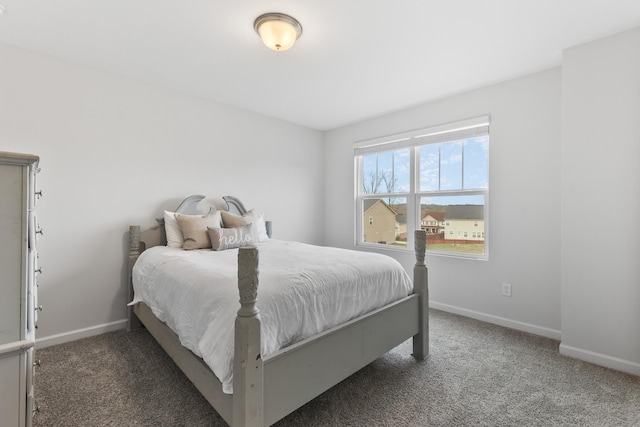 bedroom featuring dark colored carpet