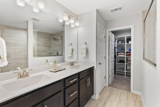 bathroom with vanity and walk in shower