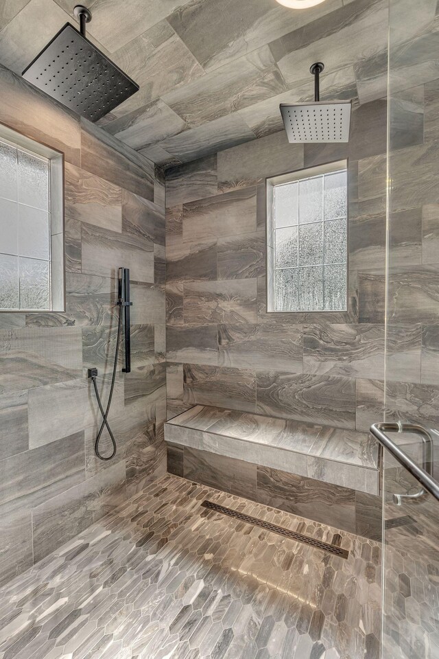 bathroom with a tile shower