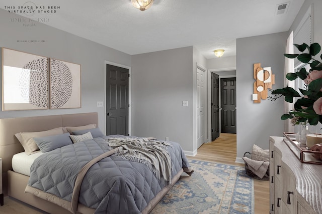 bedroom featuring light hardwood / wood-style flooring