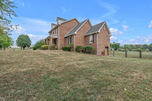 view of property exterior with a lawn