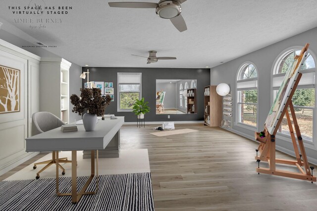 interior space with ceiling fan