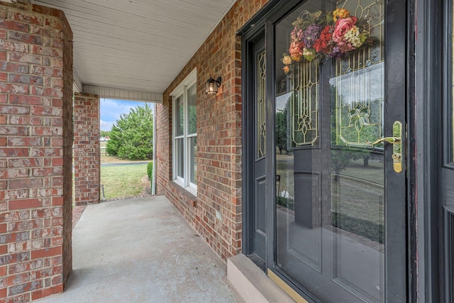 doorway to property featuring a porch