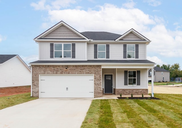 craftsman-style home with a garage and a front lawn