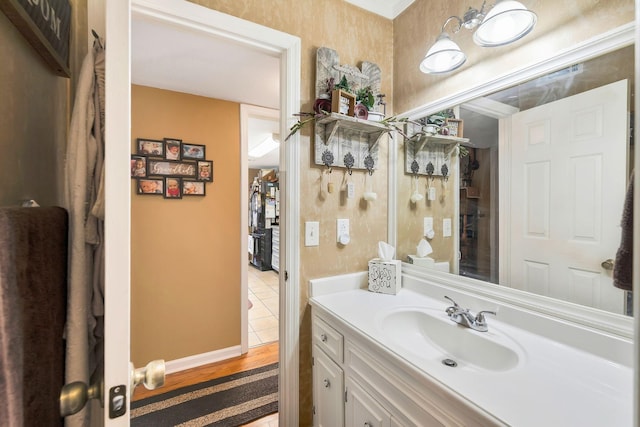 bathroom featuring vanity and wood-type flooring