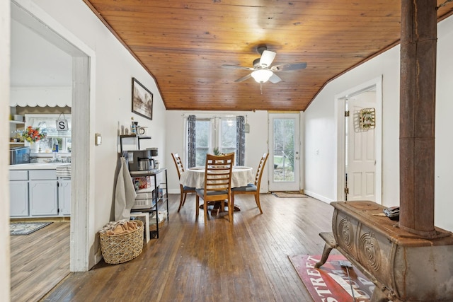 dining area with wood-type flooring, vaulted ceiling, ceiling fan, and wooden ceiling