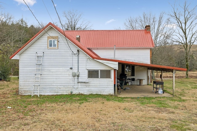 back of house with a yard