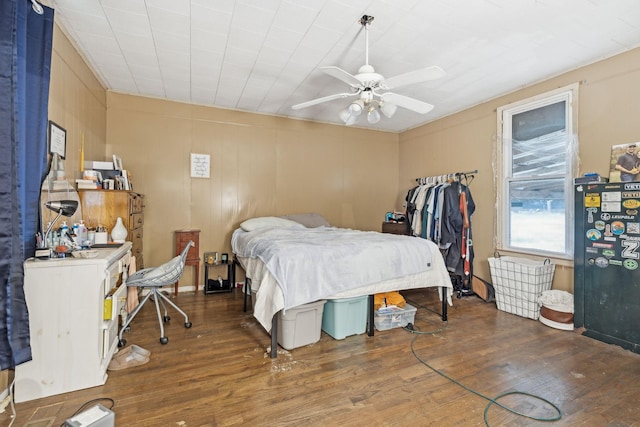 bedroom featuring dark hardwood / wood-style flooring and ceiling fan