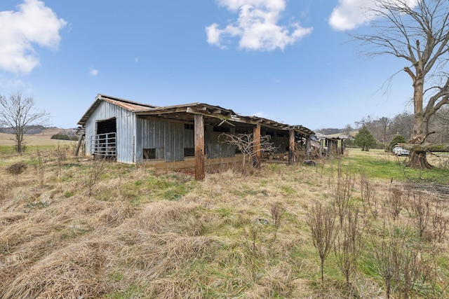 view of stable with a rural view