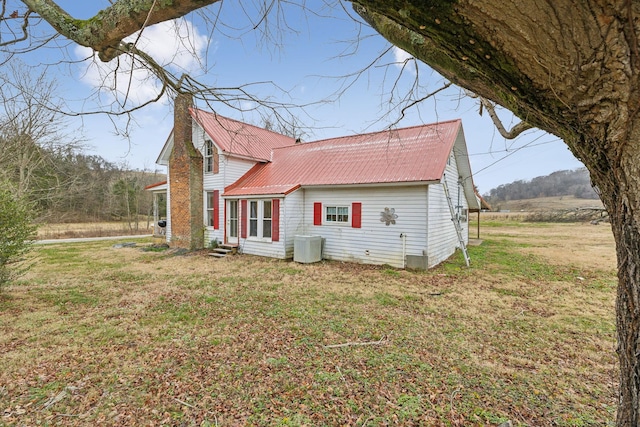 view of side of property with a yard