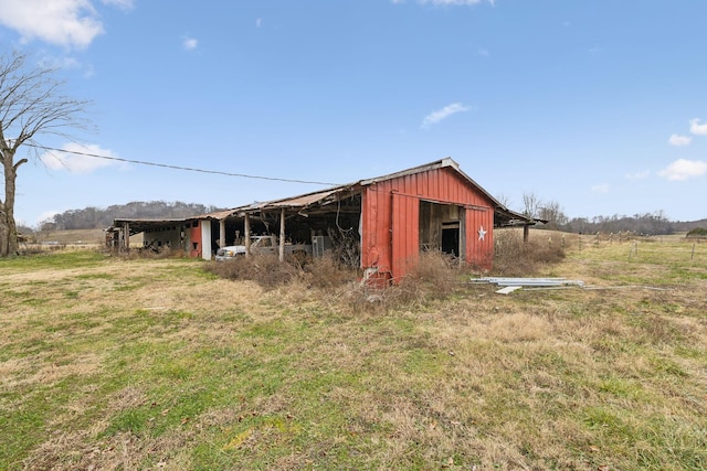 view of outbuilding featuring a rural view