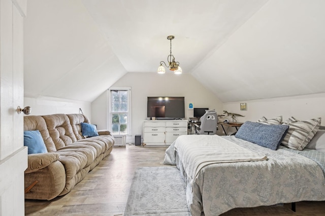 bedroom with light wood-type flooring, lofted ceiling, and a notable chandelier