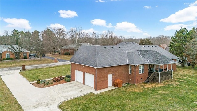 view of home's exterior featuring a garage and a yard