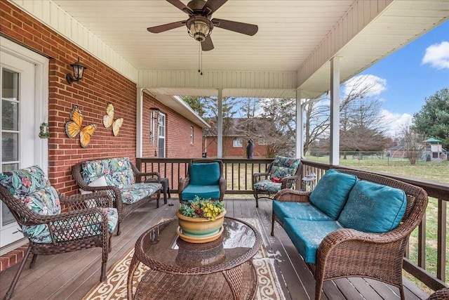 sunroom / solarium with ceiling fan