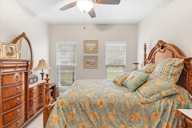 bedroom featuring ceiling fan and carpet