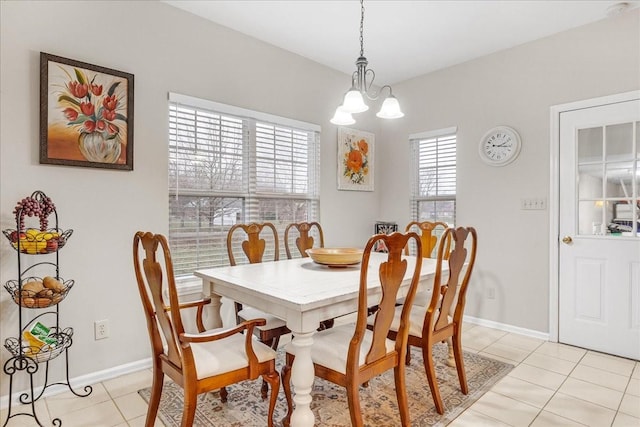 tiled dining space with a notable chandelier