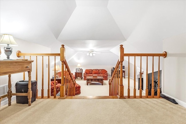 additional living space with carpet flooring, ceiling fan, and lofted ceiling