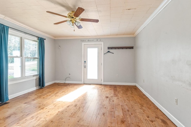 unfurnished room with ceiling fan, light hardwood / wood-style floors, ornamental molding, and a wealth of natural light