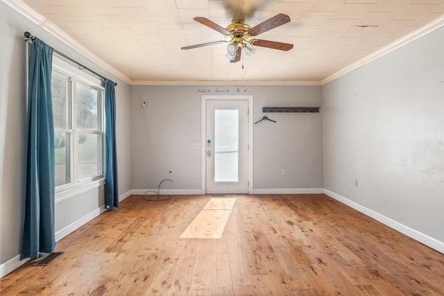 empty room with ceiling fan, light hardwood / wood-style floors, and ornamental molding